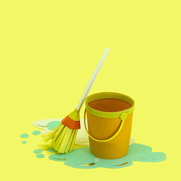 istock Paper bucket with spilled water and mop 1214245575