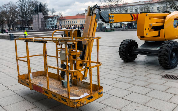 istock Yellow construction hoist on a city square. 1214251362
