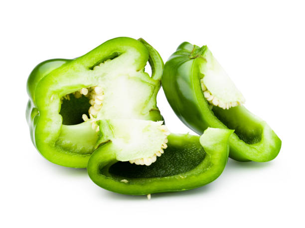 istock Green bell pepper sliced isolated on white with clipping path. 1214254558
