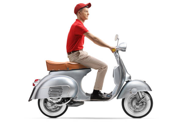 Delivery guy riding a scooter Full length shot of a delivery guy riding a scooter isolated on white background wheel cap stock pictures, royalty-free photos & images