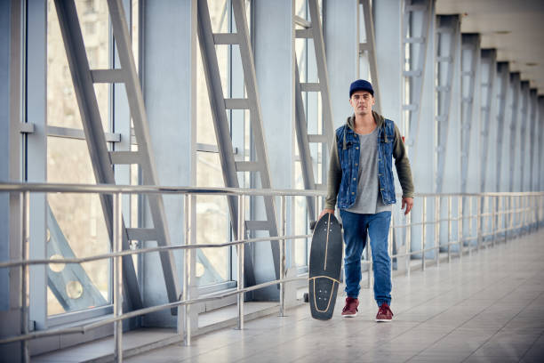 istock Man going to work in city with an alternative and ecologic way. Active guy enjoying everyday life moments doing sport 1214255124