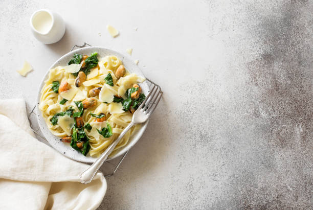 istock Pasta with mussels, spinach and parmesan cheese 1214257001