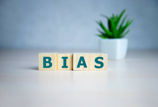 Bias - word from wooden blocks with letters, personal opinions prejudice bias concept, random letters around, white background Bias - word from wooden blocks with letters, personal opinions prejudice bias concept, random letters around, white background. judgement photos stock pictures, royalty-free photos & images
