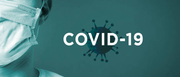 COVID-Covid-19 on blue background with man wearing mask New Coronavirus name adopted by World Health Organisation is COVID-19.  COVID-19 on blue background with man in mask world health organization photos stock pictures, royalty-free photos & images