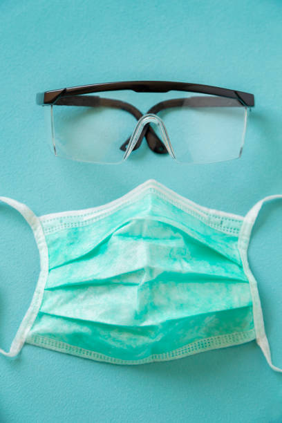 istock Medical face protection mask and glasses 1214257670
