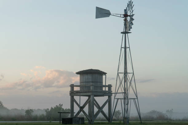 istock Vintage farm windmill for pumping water 1214258890