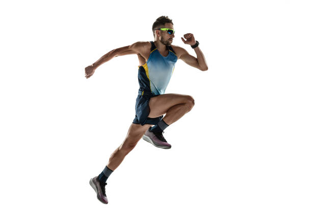 istock Triathlon male athlete running isolated on white studio background 1214259505