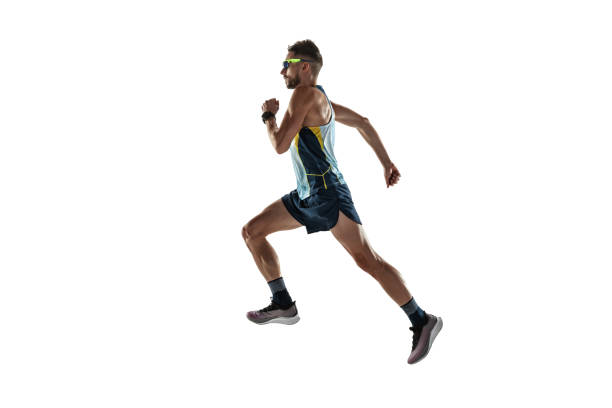 istock Triathlon male athlete running isolated on white studio background 1214259653