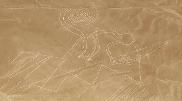 Monkey geoglyph, Nazca mysterious lines and geoglyphs aerial view, landmark in Peru
