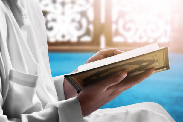 istock Religious muslim man reading holy quran 1214263840
