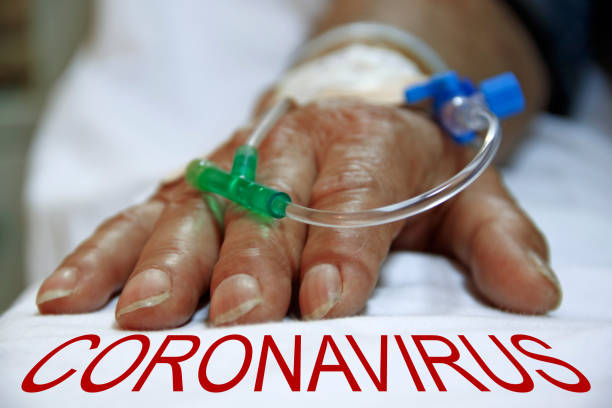 Coronavirus covid-19 infected patient's hand closeup stock photo