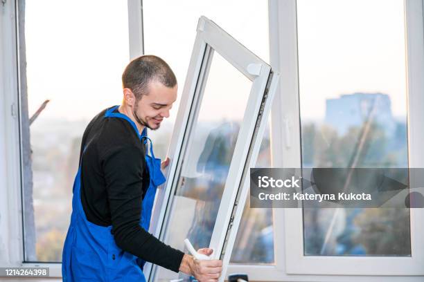 Professional Master At Repair And Installation Of Windows At Work Stock Photo - Download Image Now