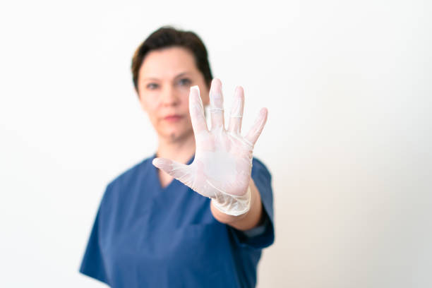 istock female doctor showing stop gesture 1214265431