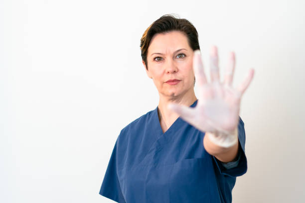 istock female doctor showing stop gesture 1214265662