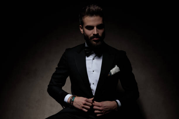 istock businessman sitting and fixing his jacket cool 1214265736
