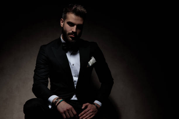 istock young businessman sitting and looking at camera with attitude 1214265816