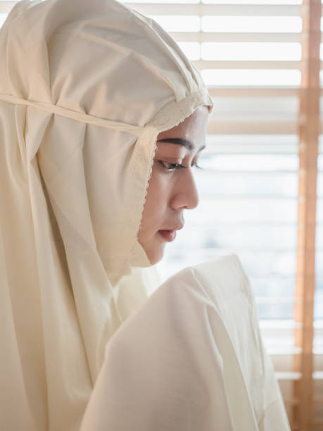 istock Young Muslim woman performed prayer 1214268097