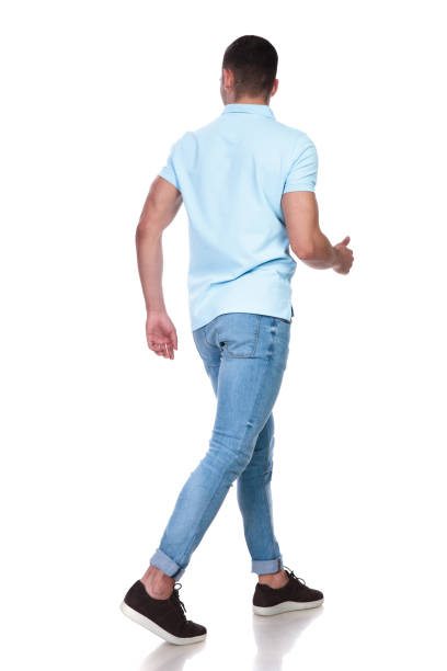 istock rear view of a man walking around on his way 1214268435