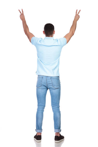 istock man raising his hands as a sign of peace 1214268513