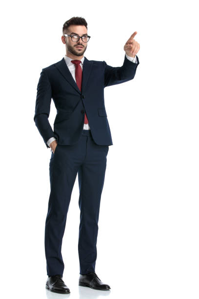 istock businessman standing and pointing forward serious 1214268855