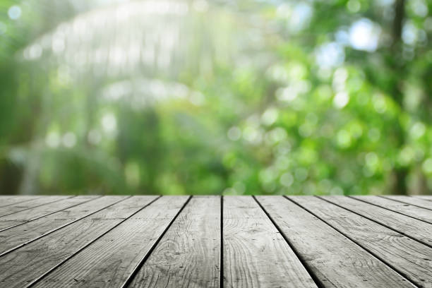 istock Wooden desk and blurred nature bokeh background. 1214270708