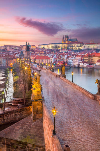 Prague, Czech Republic. Aerial cityscape image of Prague with famous Charles Bridge and Prague Castle during beautiful sunset. charles bridge prague stock pictures, royalty-free photos & images
