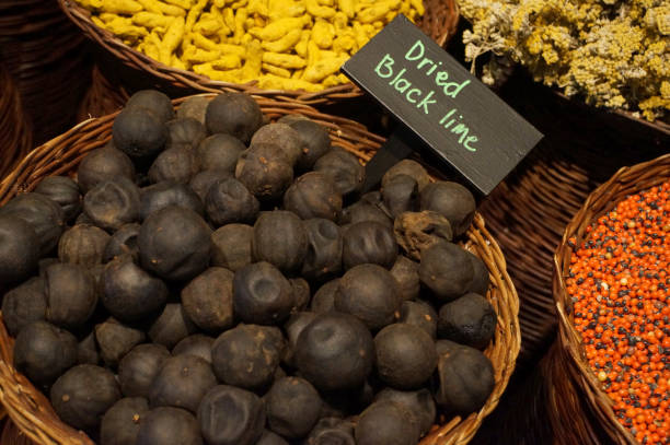 dried black lemon for sale on the arab street market stall. Dubai Spice Souk in Deira, United Arab Emirates.