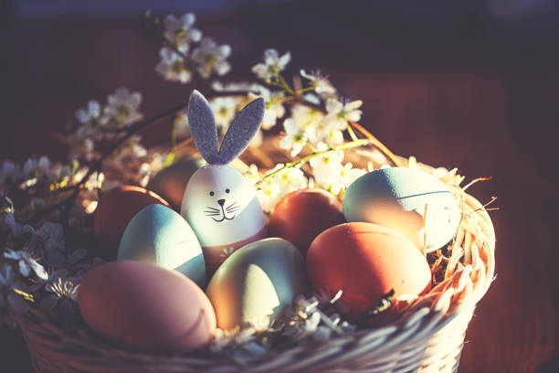 istock Easter decoration with crafted Easter bunny in the sunny nest 1214273794