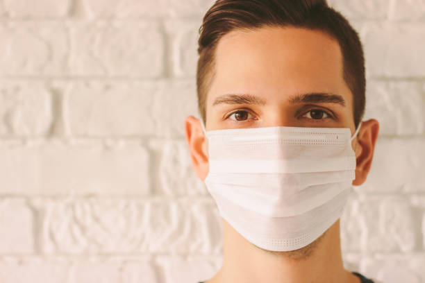 istock Young doctor wearing protective face mask as preventive measure 1214273903