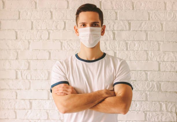istock Confident doctor wearing face mask for protection against viruses 1214274056