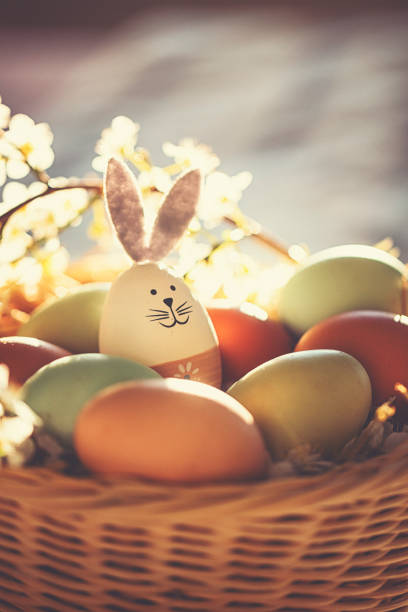 Easter decoration with crafted Easter bunny in the sunny nest