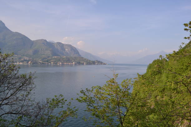 istock Lake Como, lakefront and mountains in a sunny day. 1214275808