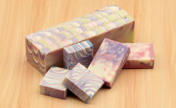 istock Soap block and soap bars on display on a wooden background 1214276106