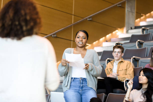 istock Female college student gives oral presentation 1214278953