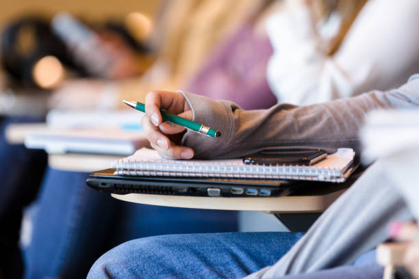 istock Unrecognizable male college student in lecture hall 1214279032
