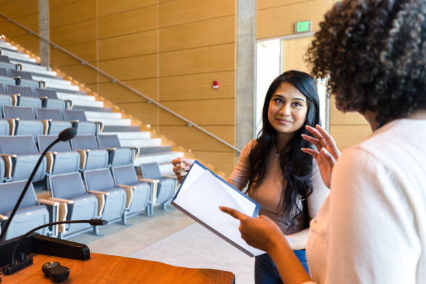 istock College professor reviews student's paper 1214279048