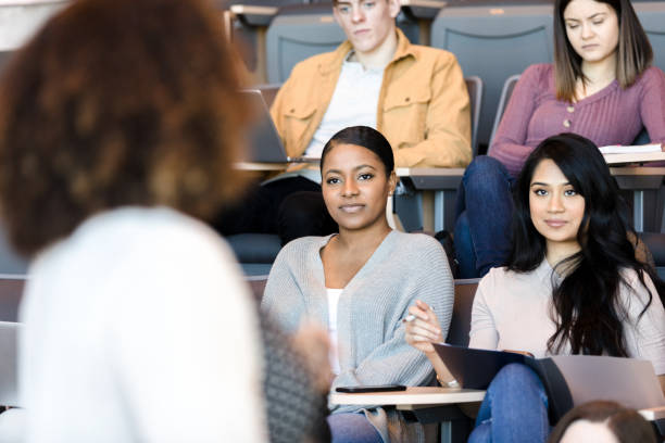 istock Unrecognizable professor giving lecture to class full of students 1214279083