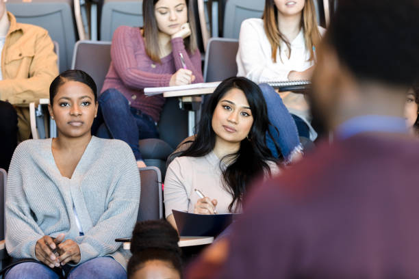 istock Serous students listening to college professor 1214279104