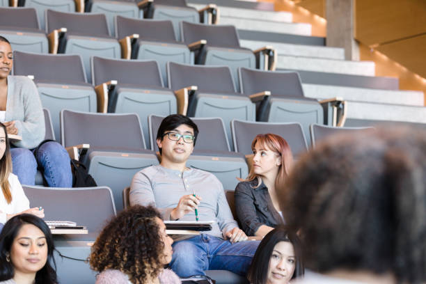 istock Young Asian male college student listens during lecture 1214279111