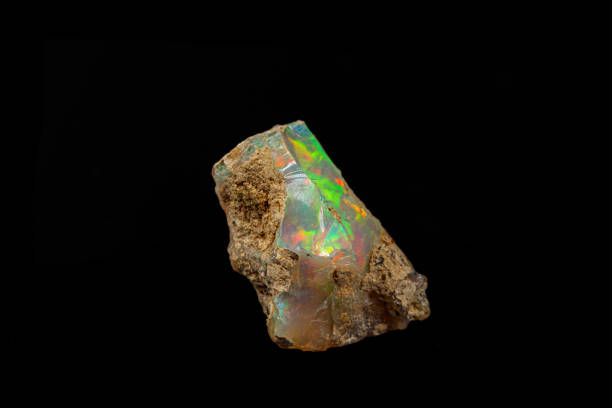 istock macro mineral stone rare and beautiful opals on a black background 1214279121