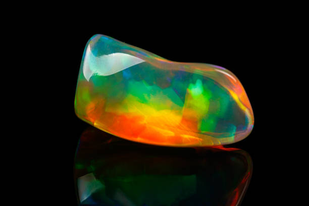 istock macro mineral stone rare and beautiful opals on a black background 1214280058
