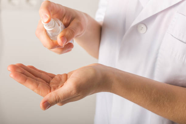 istock Doctor hands using washing hand with Alcohol Sanitizer  on a white background. Protect themselves from virus infection in Corona virus crisis 2020 1214281598