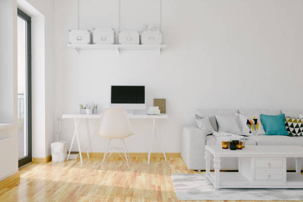 Modern Home Office Interior Interior of a modern living room with sofa, coffee table and desk. studio workplace stock pictures, royalty-free photos & images