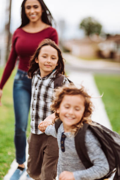 istock mother carrying the sons at school 1214284963