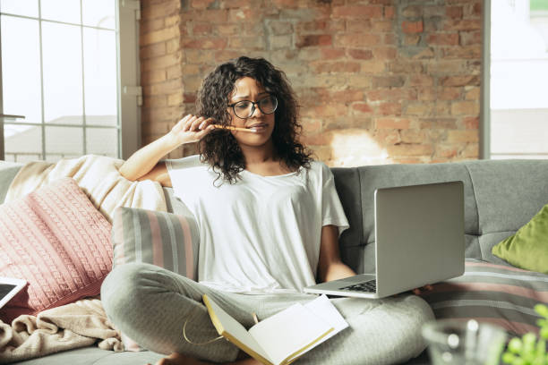 istock African-american woman, freelancer during the work in home office while quarantine 1214285494