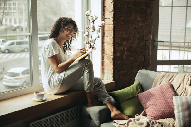 istock African-american woman, freelancer during the work in home office while quarantine 1214285641