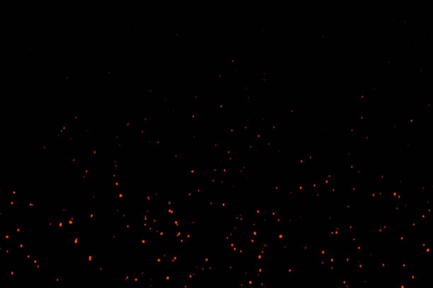 Horizontal Beautiful Burning Hot Sparks Rising from small red Fire in dark Night. Abstract alpha Isolated Fire Glowing Particles on Black Background.Slow Motion. Looped Animation. Moving Side.4K