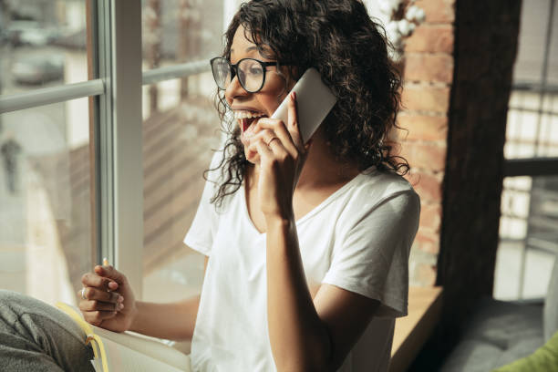 istock African-american woman, freelancer during the work in home office while quarantine 1214287102