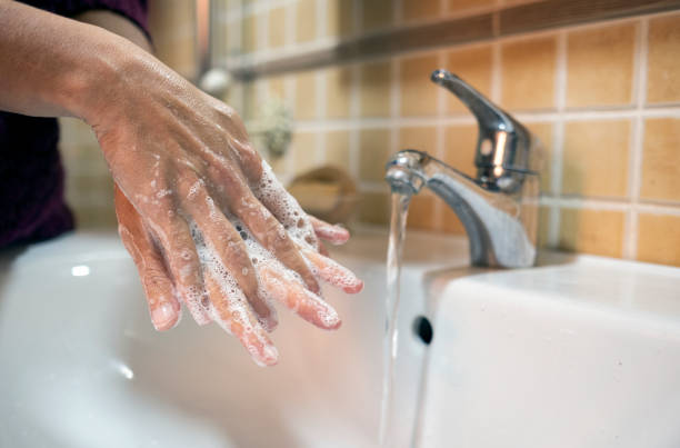 istock person washing their hands in the bathroom 1214288087