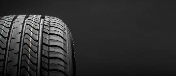 istock a black isolation rubber tire, on the black backgrounds 1214288736